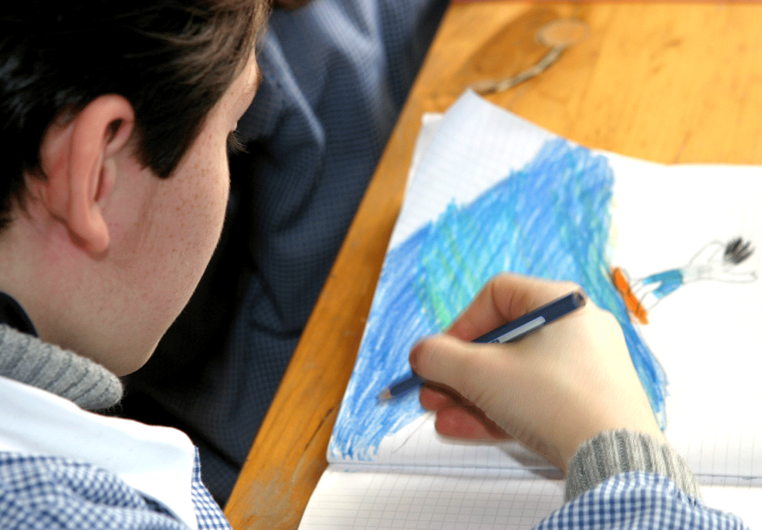 boy colouring a picture