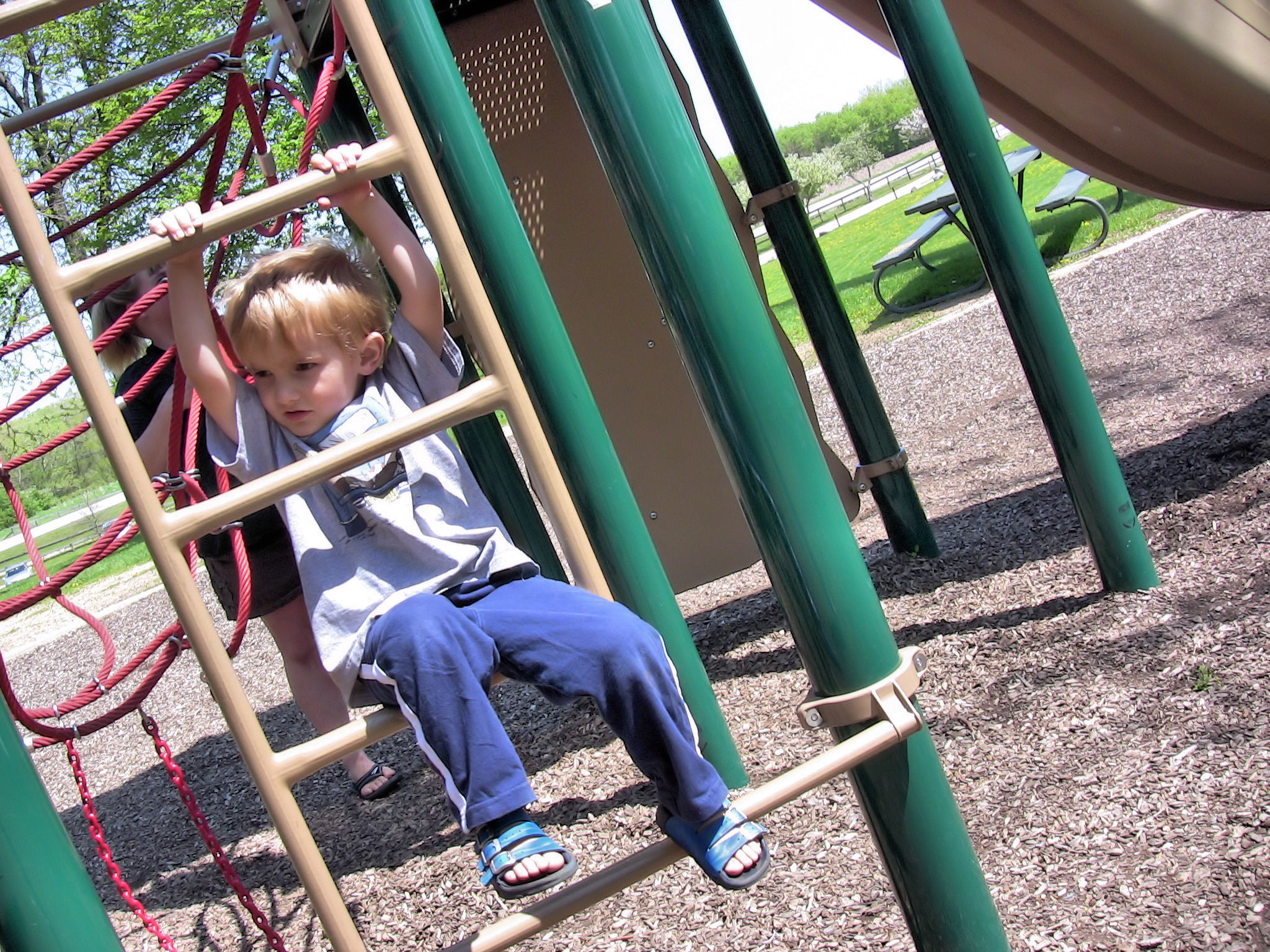 young child on playset